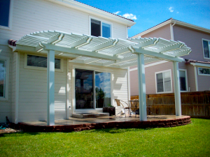 A white wooden patio cover on a sunny day