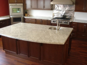 Colonial cream granite with cherry cabinets